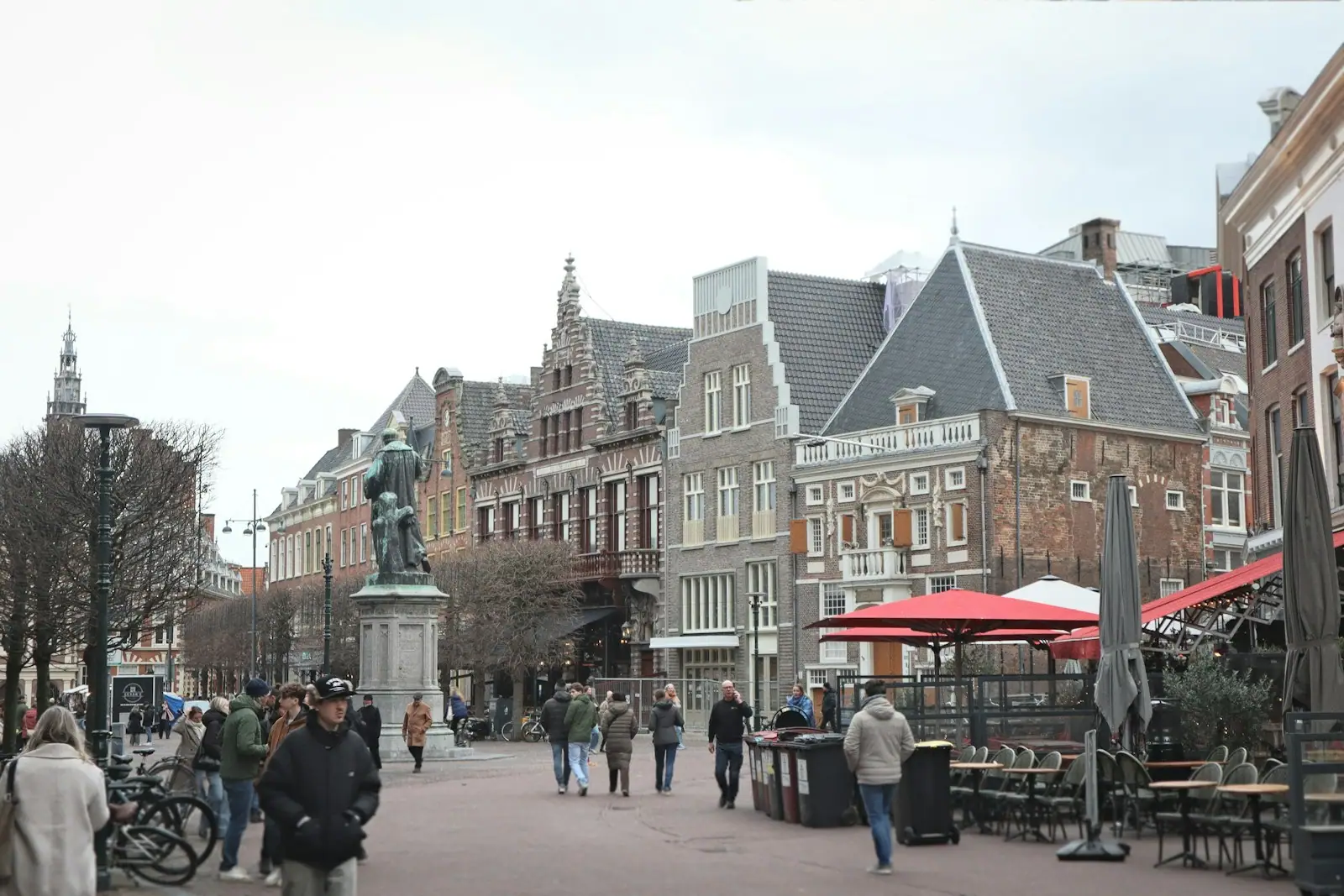 People walking on a street lined with historic buildings
