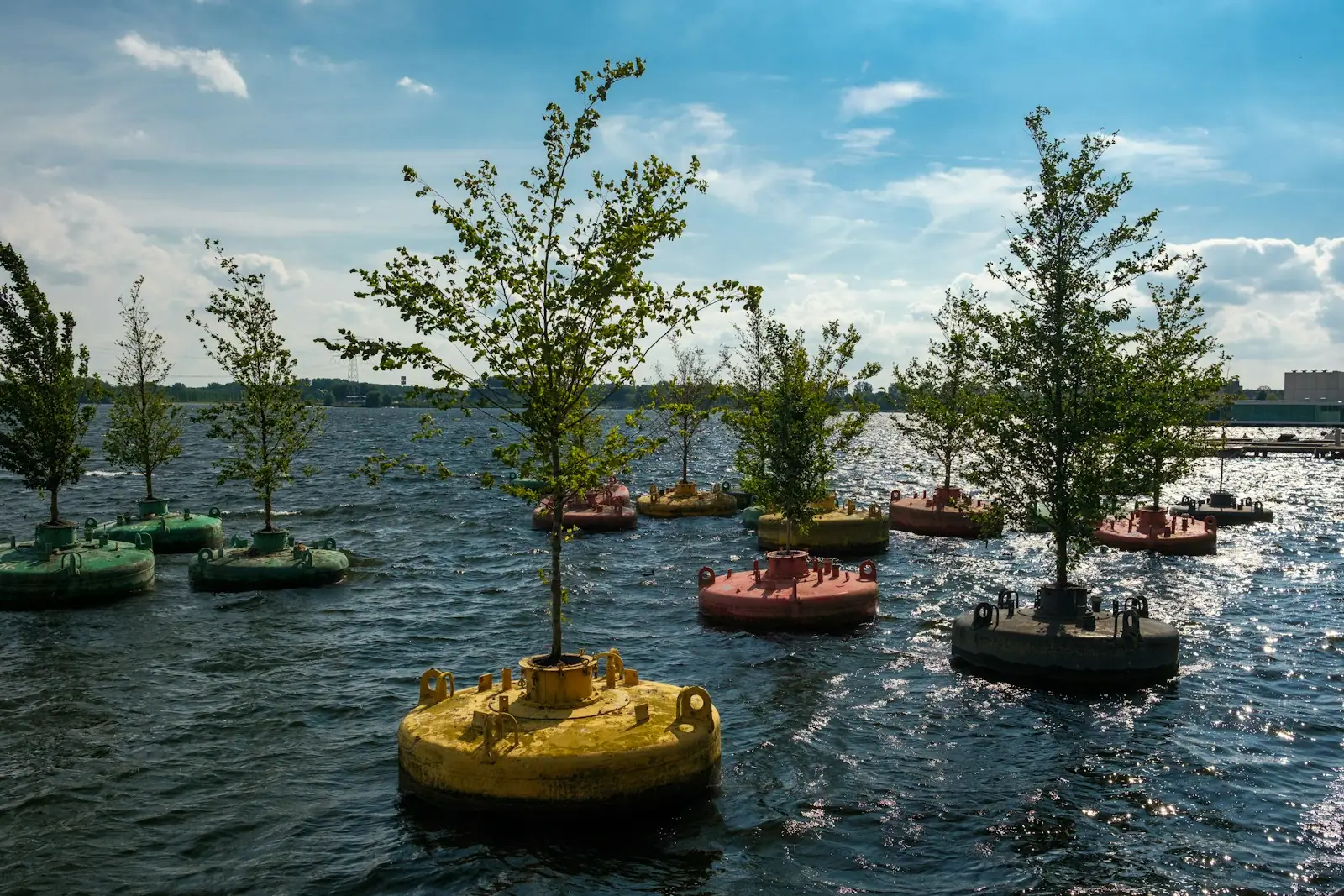 A group of small boats floating on top of a lake