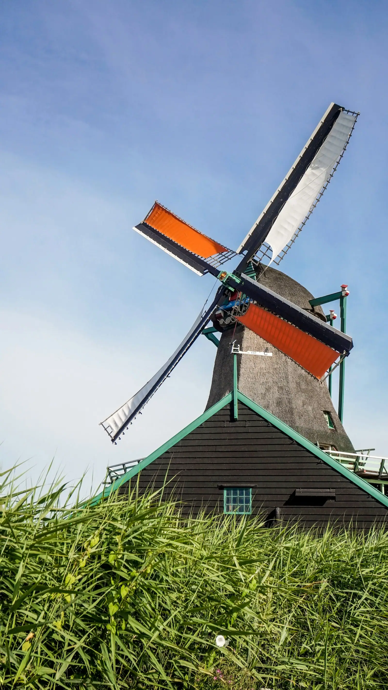 A windmill next to a house