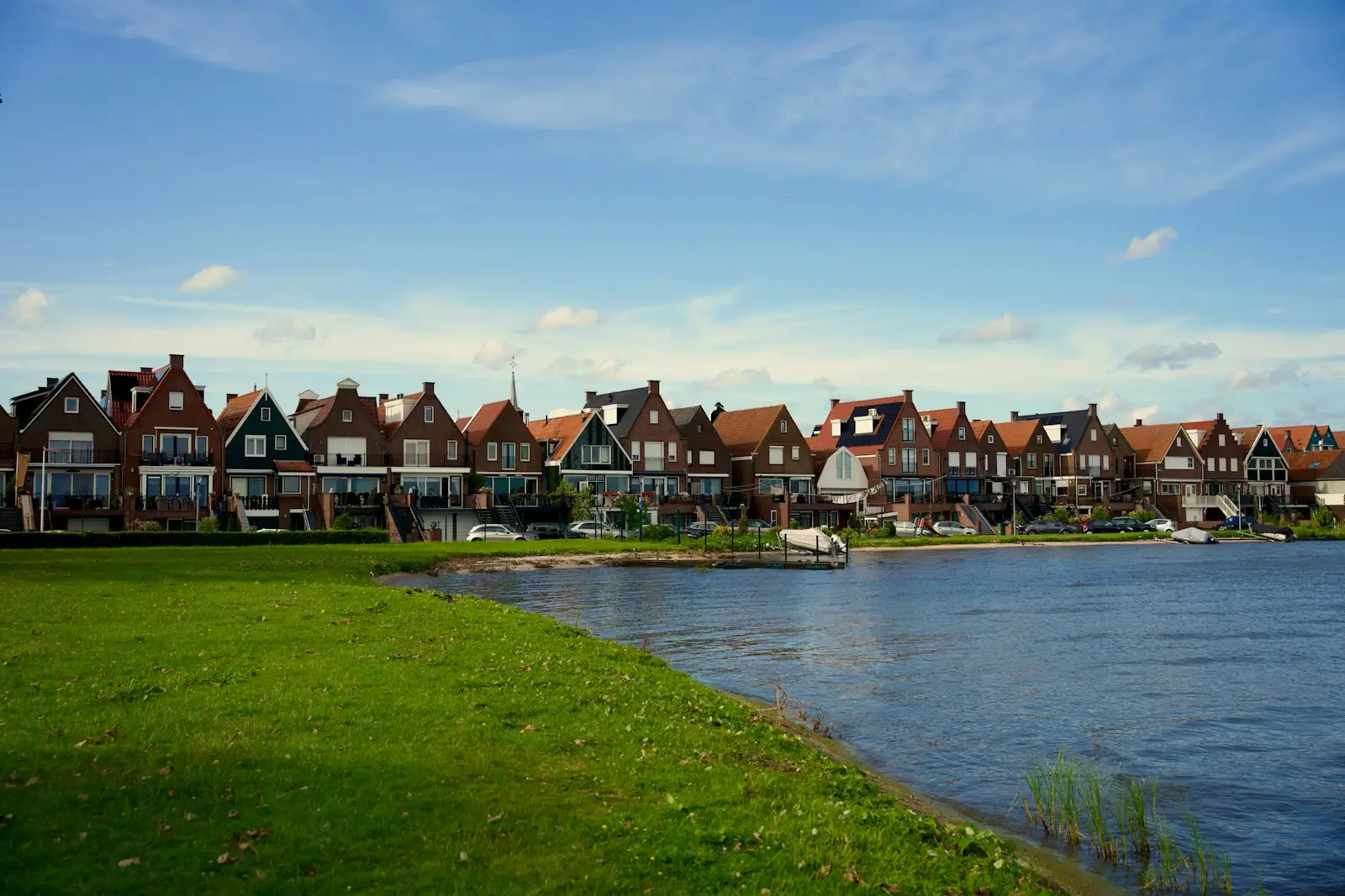 A row of houses next to a body of water