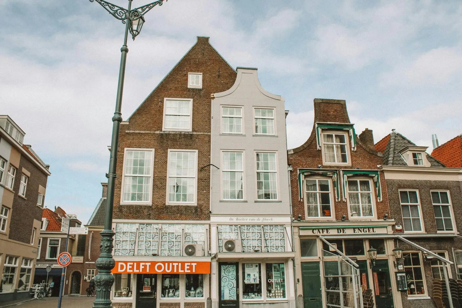 Brown and white concrete building under white clouds during daytime