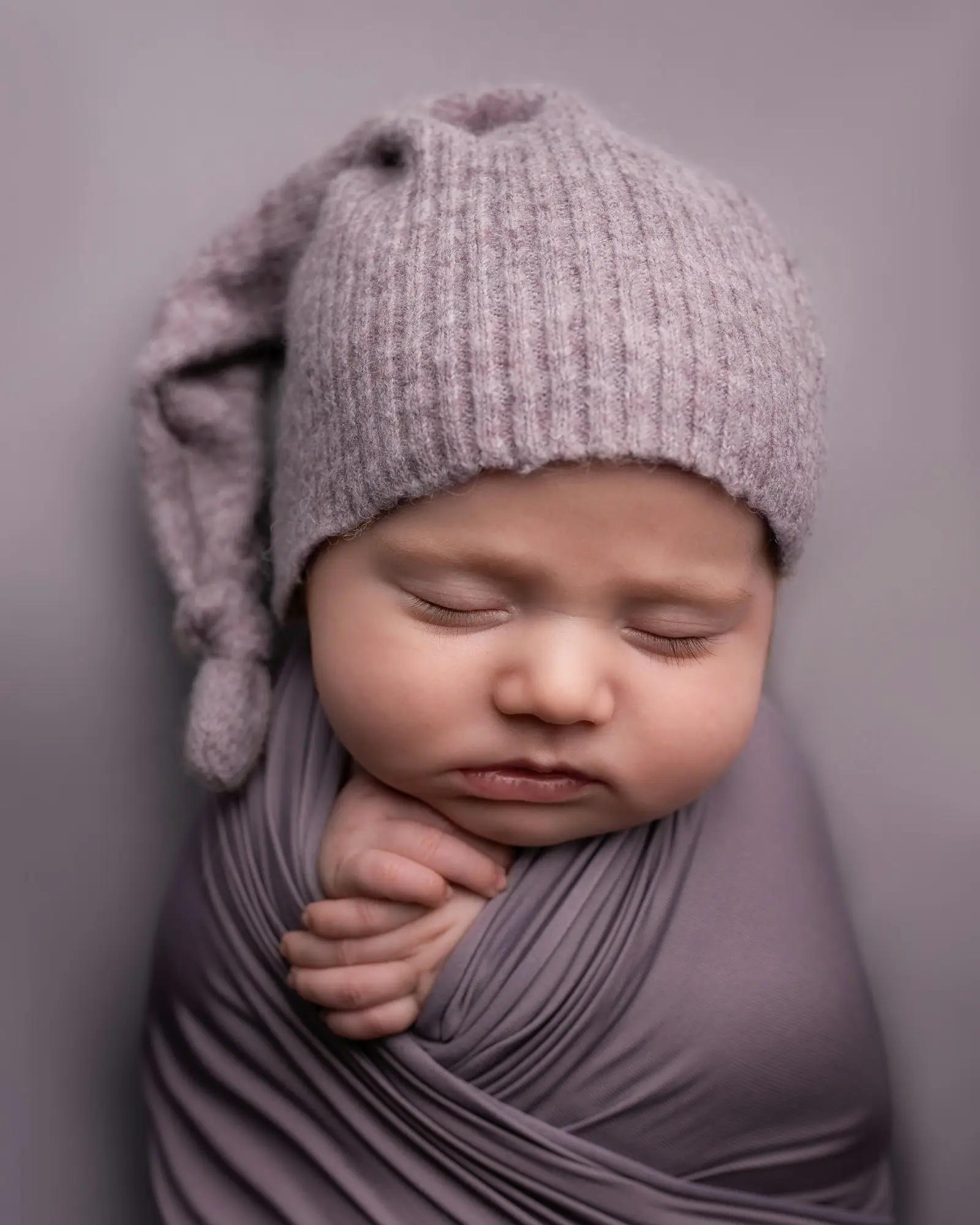 Child in gray knit cap