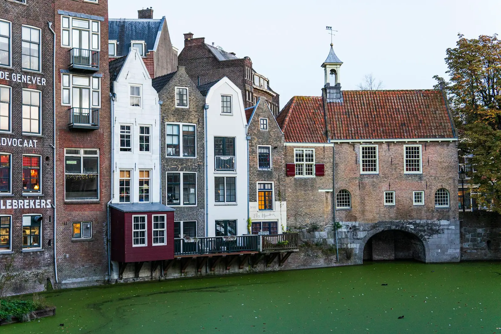 A row of buildings next to a body of water