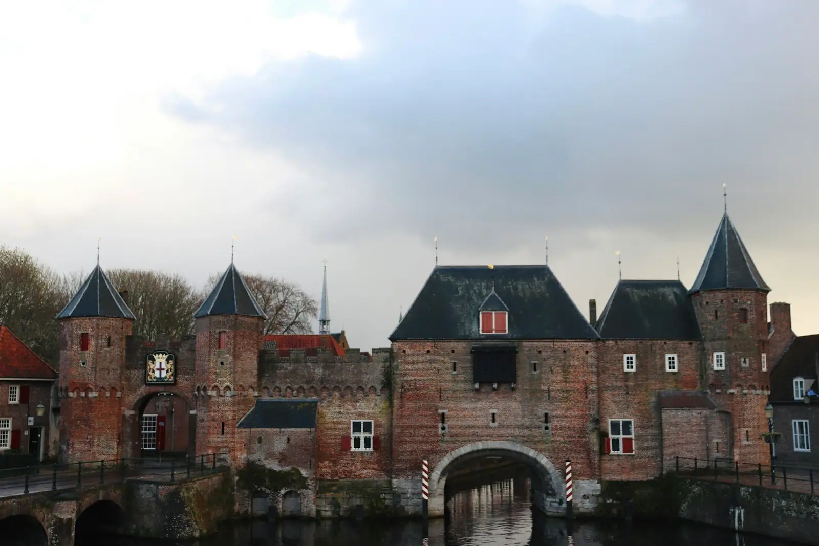 A large brick building with a bridge