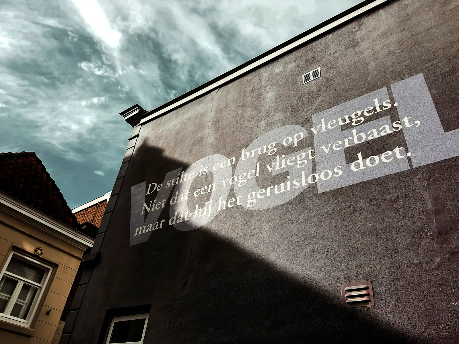 A building with a sign on the side of it