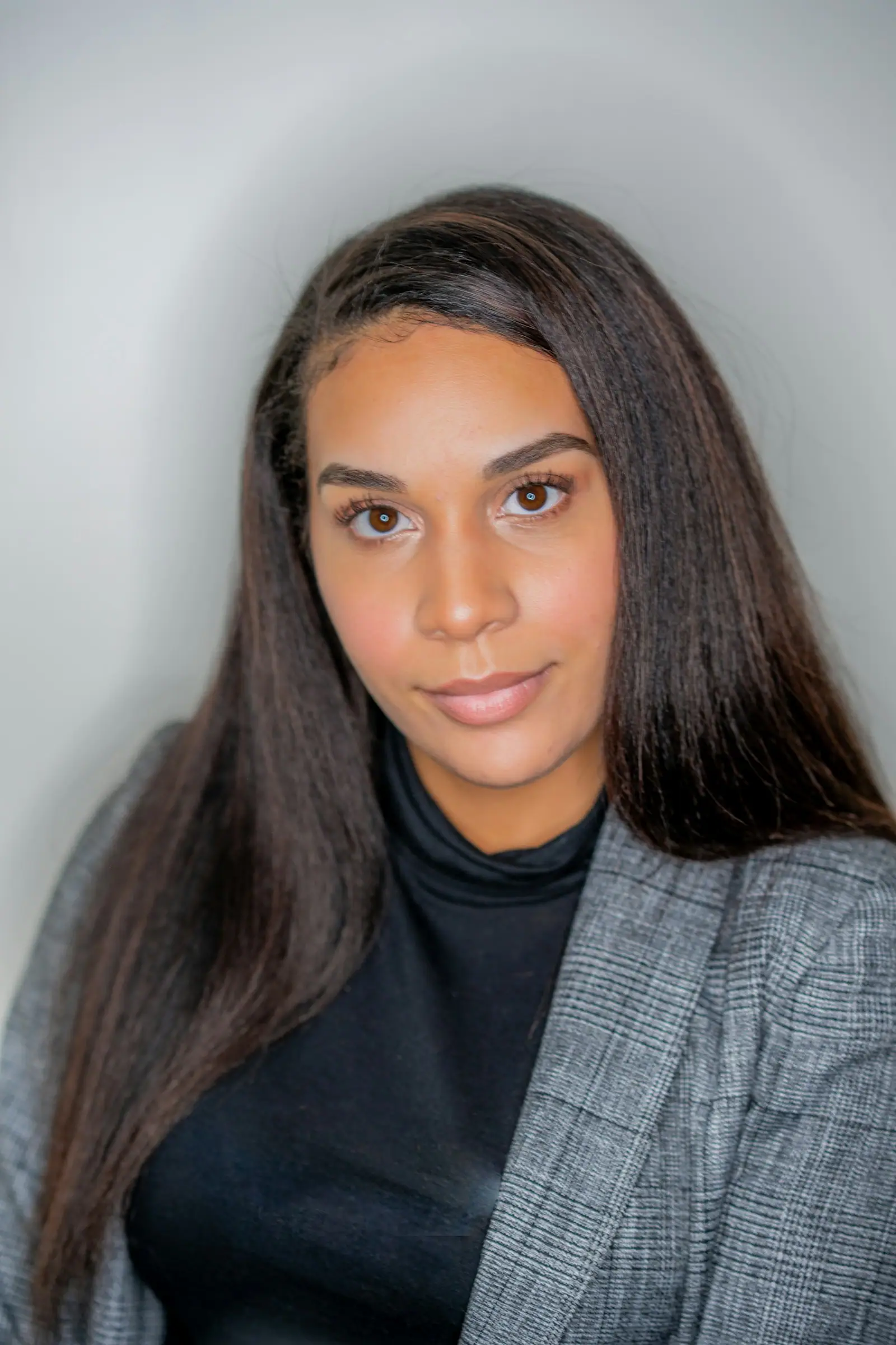 Woman in gray and black scarf