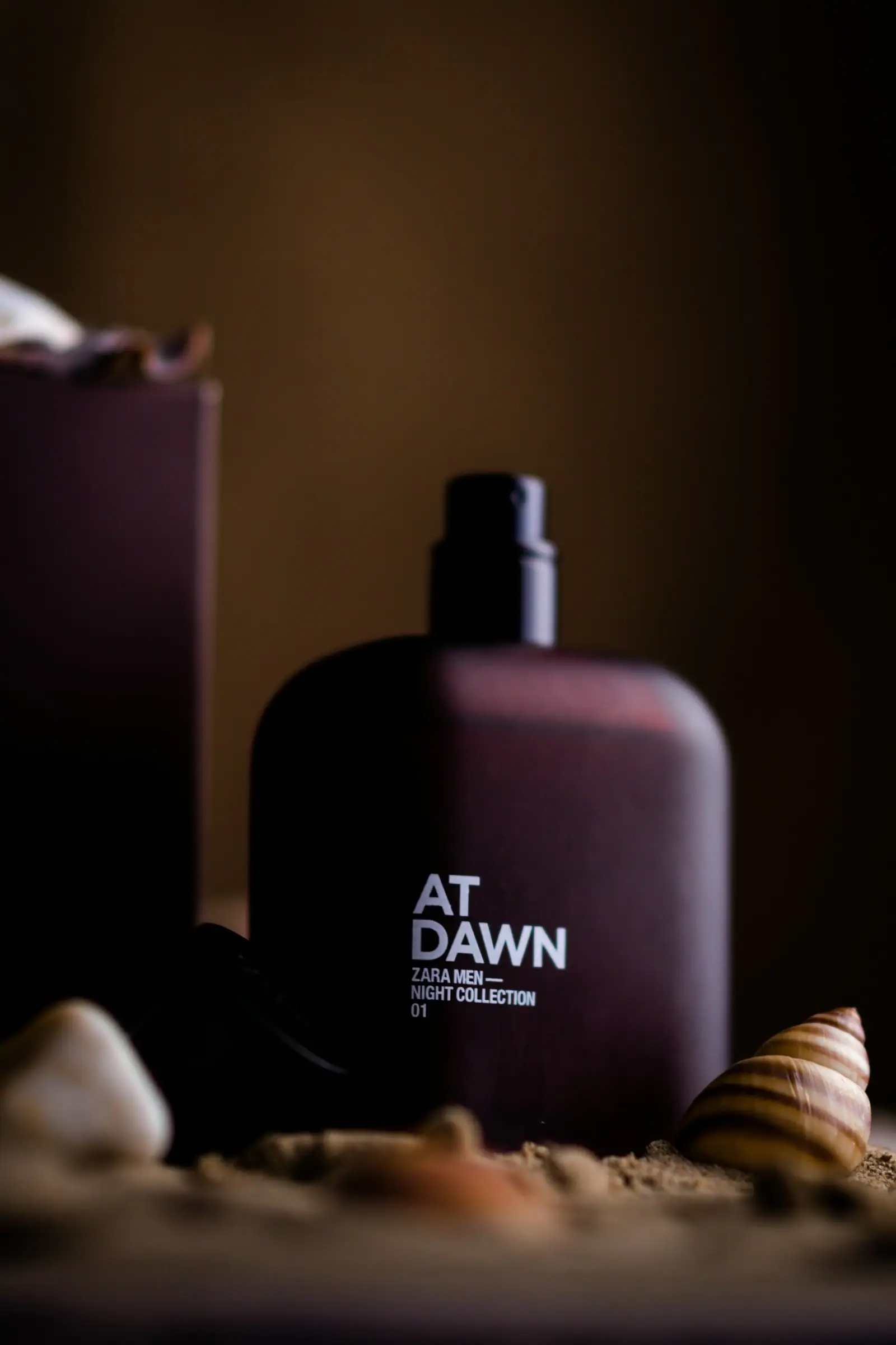 A bottle of perfume sitting on top of a table