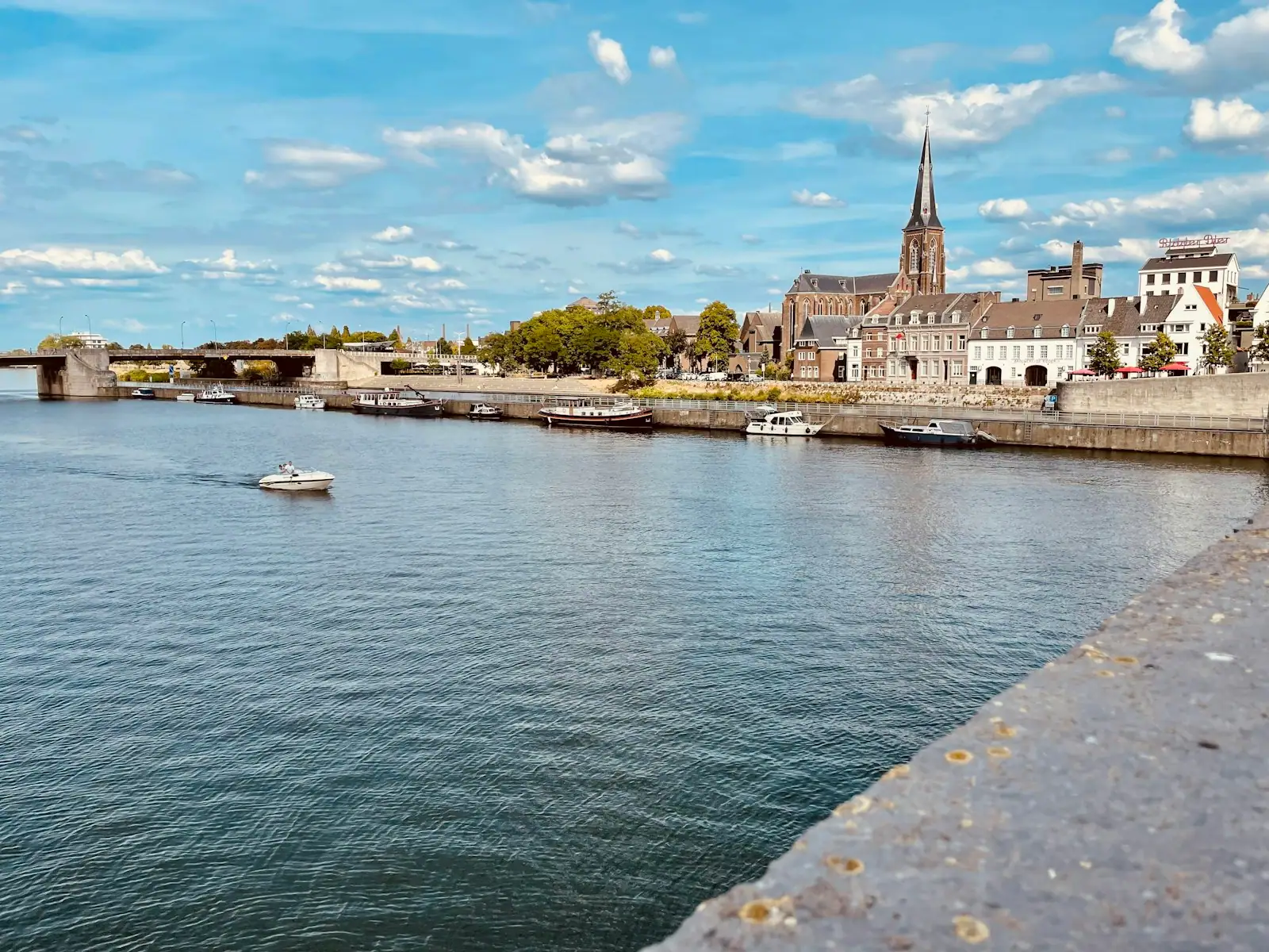 A body of water with boats in it and buildings in the back